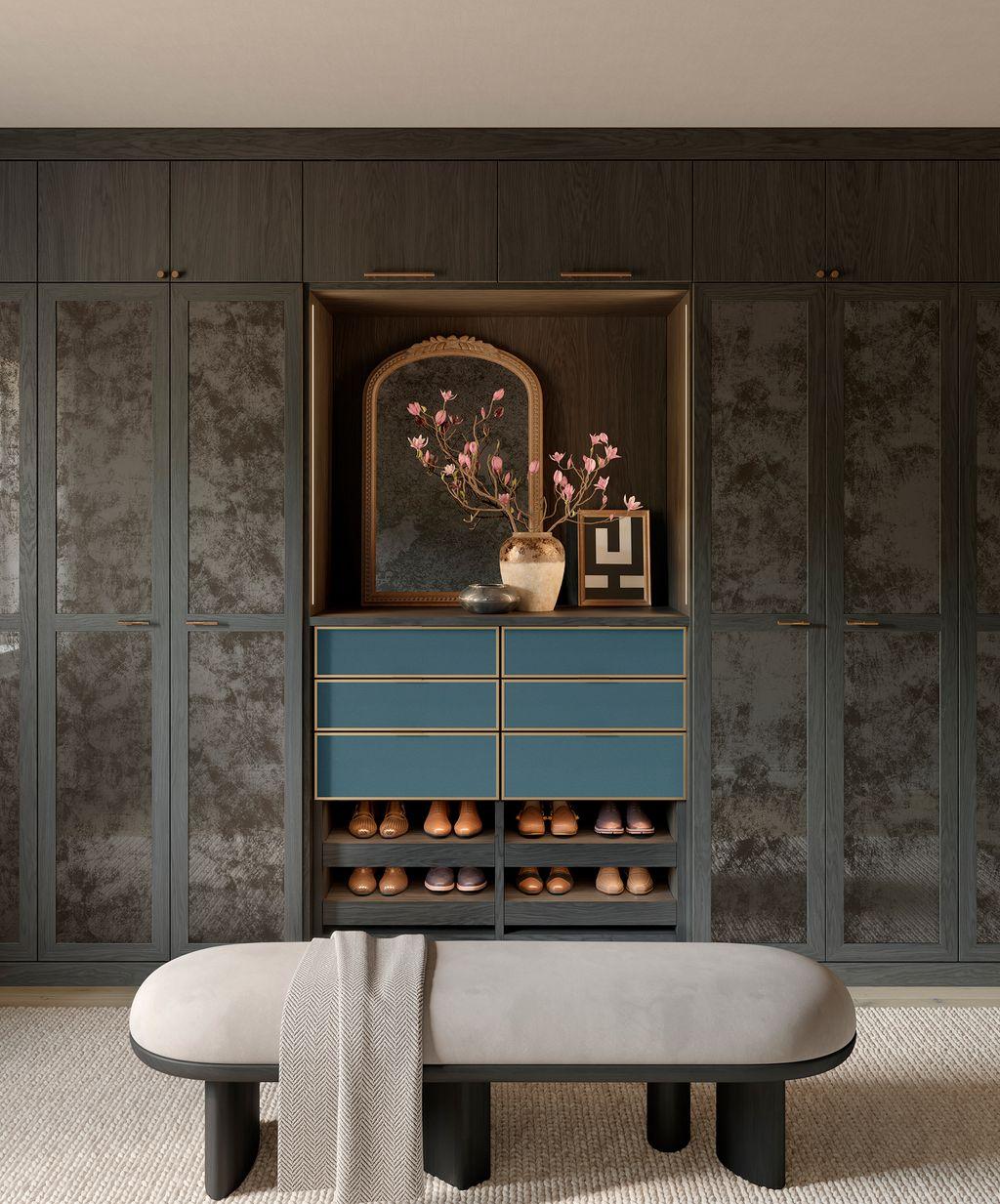 Walk in closet designed by Jeremiah Brent with California Closets in dark wood grain finish