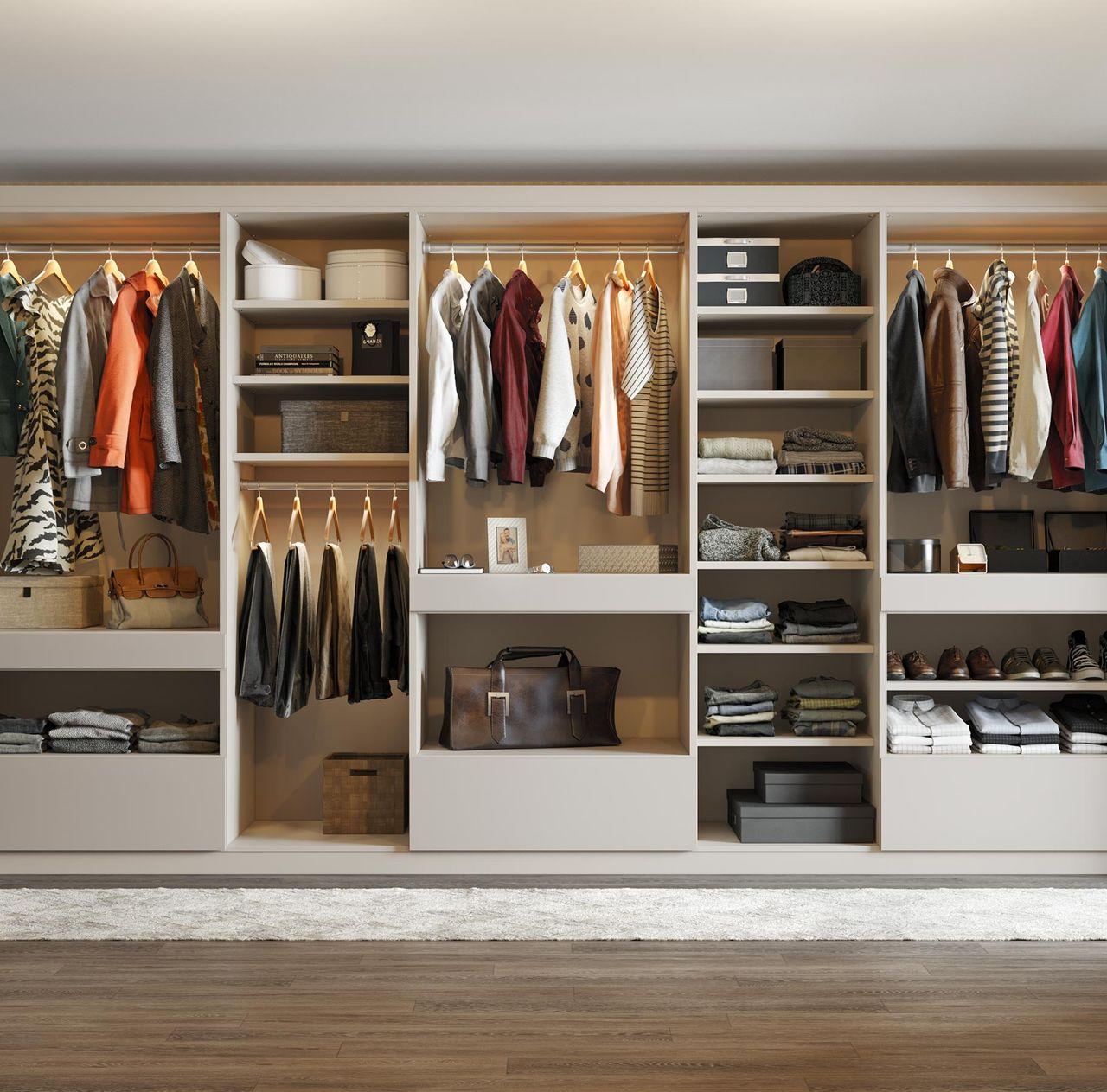 Customized long open reach in closet with open shelving and lighting by California Closets