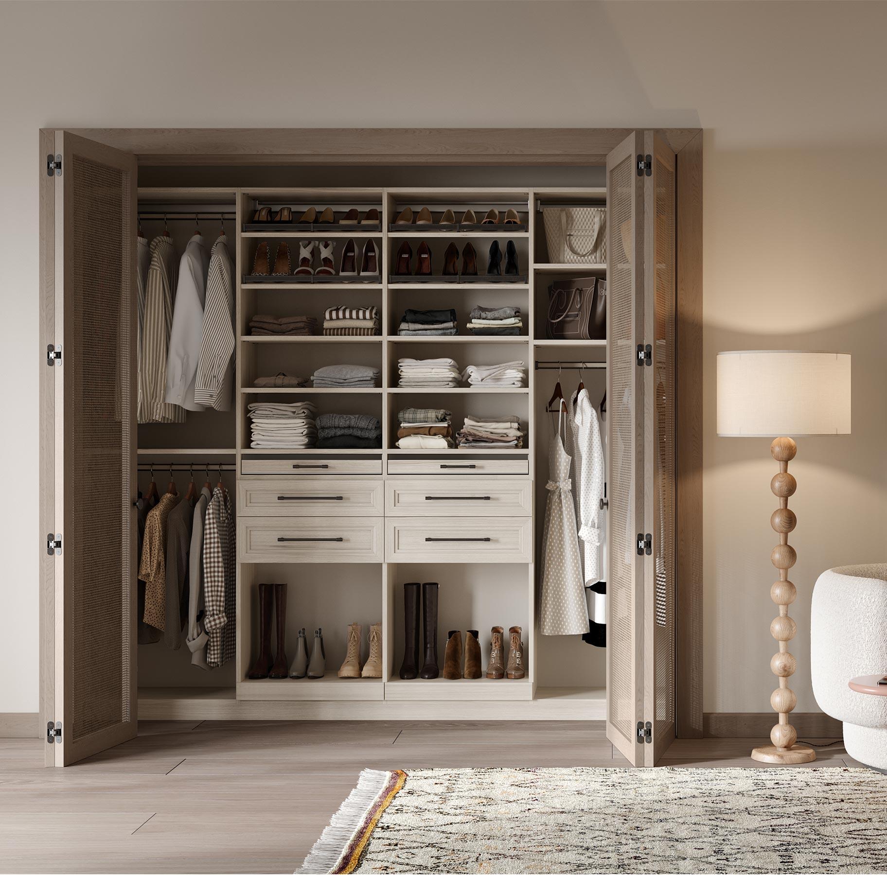 Light custom reach-in closet with storage shelves designed by California Closets