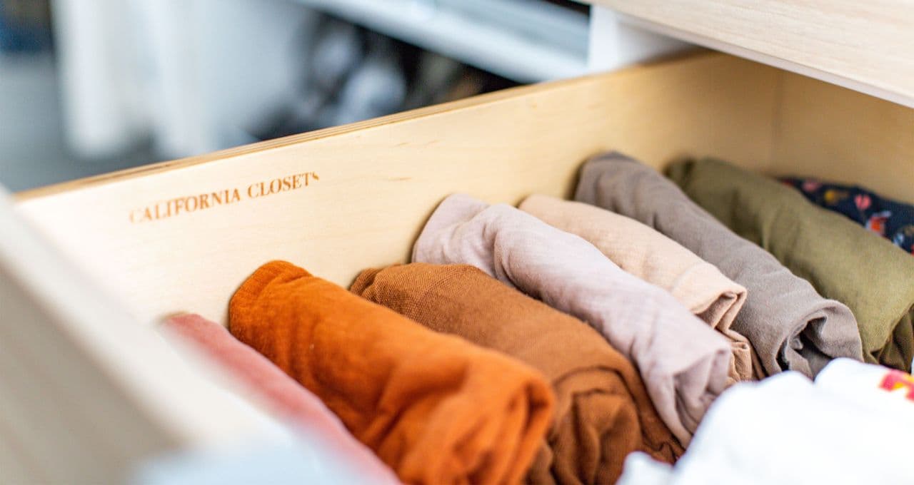 Walk in closet custom drawers with organizing inserts by California Closets
