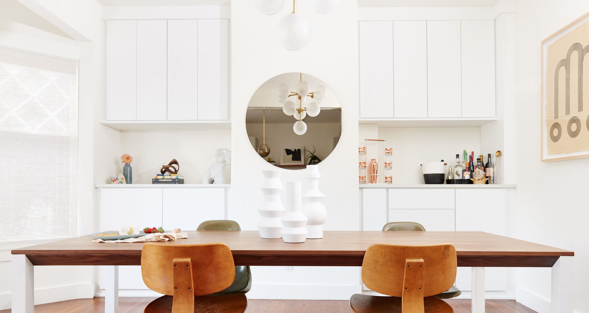 Workspace designed with custom pantry storage cabinets and drawers in white finish by California Closets