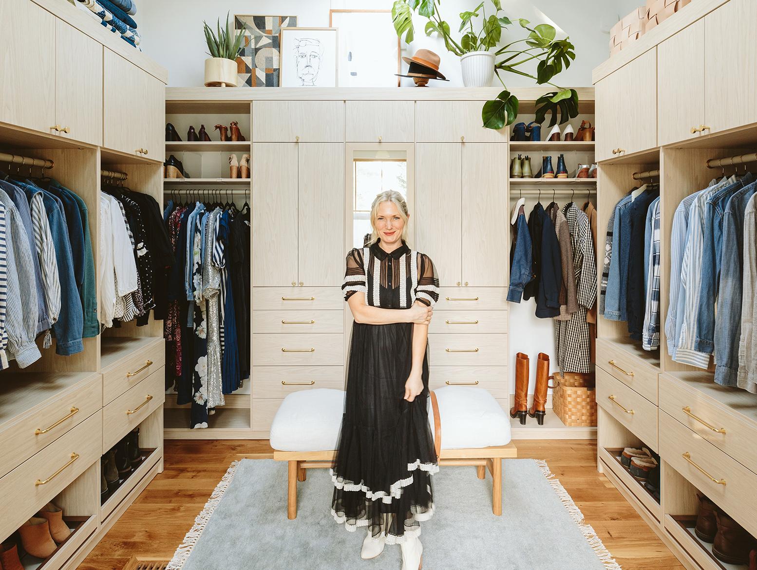 A high ceiling farmhouse customized with a walk in closet, shoe storage, custom drawers, and cabinets by California Closets