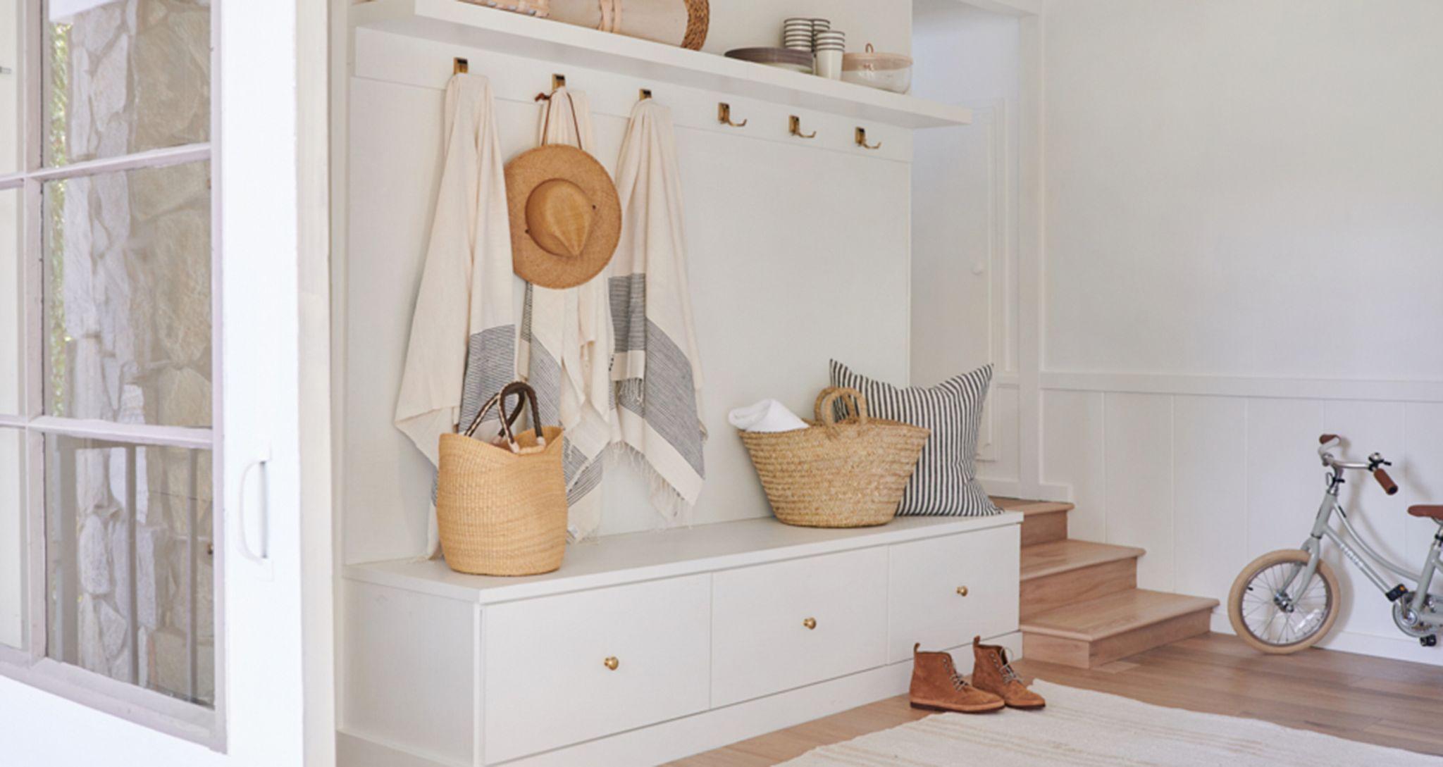 Custom mudroom storage drawers and bench at Jenni Kayne's homeCalifornia Closets