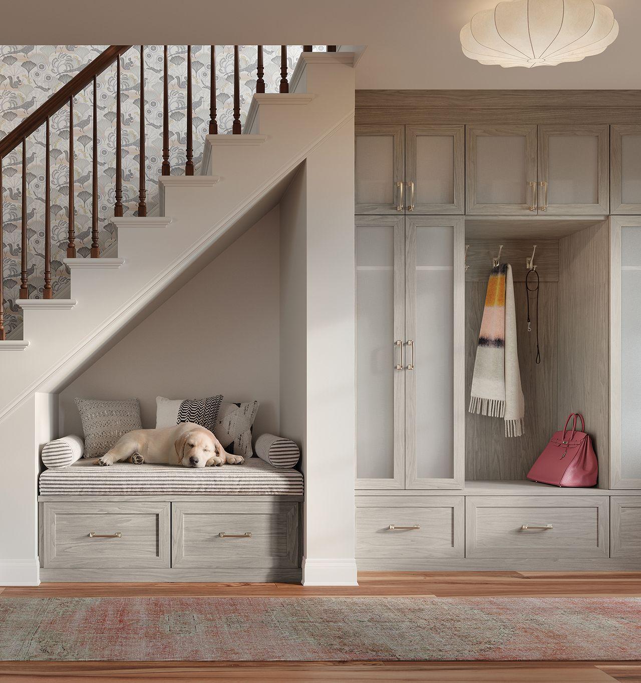 Foyer design with to ceiling closet cabinets and bench seat by California Closets