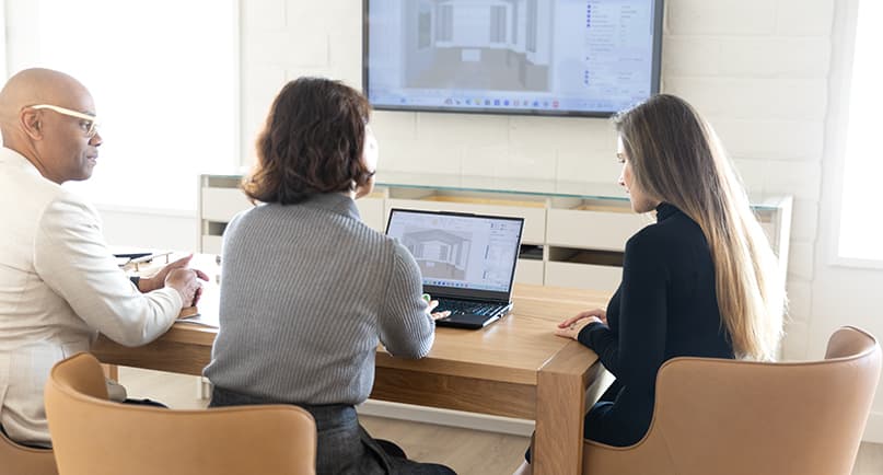 In home design consultation with a professional designer taking notes on the space and measurements by California Closets