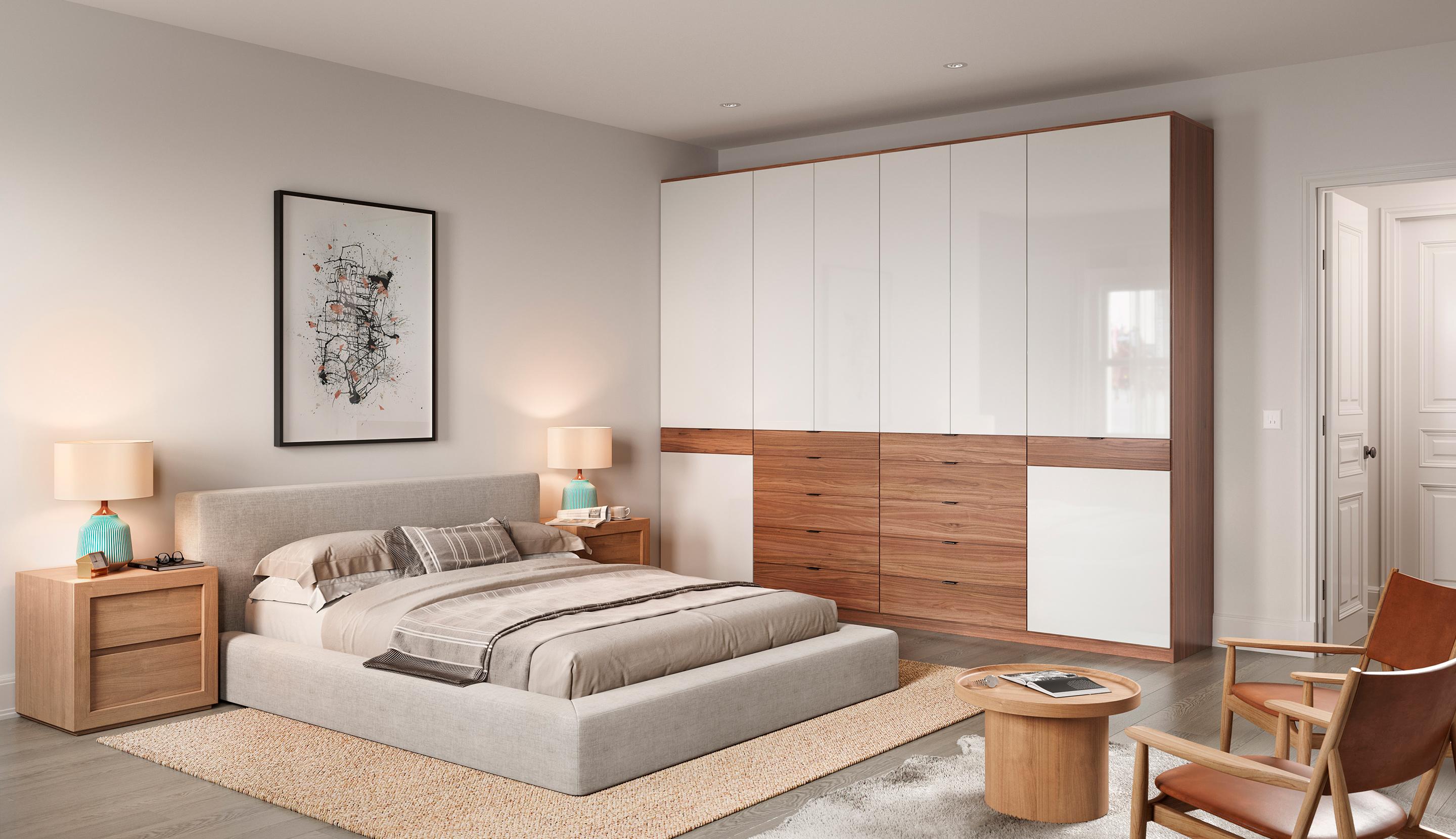 Armario de dormitorio instalado con gabinetes de almacenamiento personalizados, iluminación LED y acabados luminosos de California Closets
