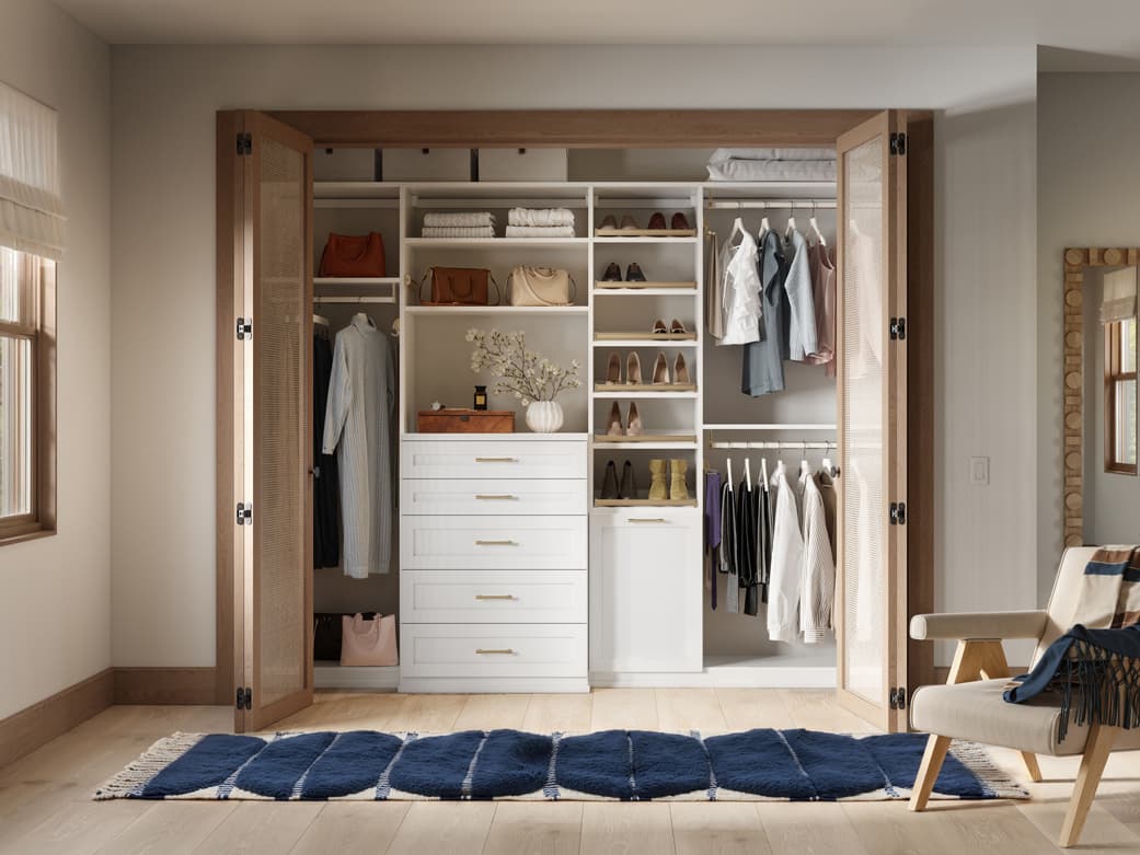 Custom closet system reach in design with custom drawers and shoe storage by California Closets