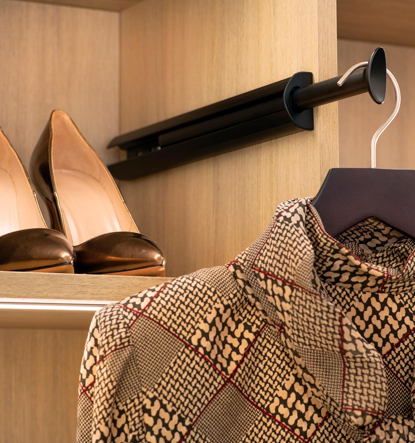 Custom closet accessories valet rack with custom lighting by California Closets