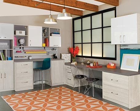 Custom craft storage solution shelving and built in desks by California Closets