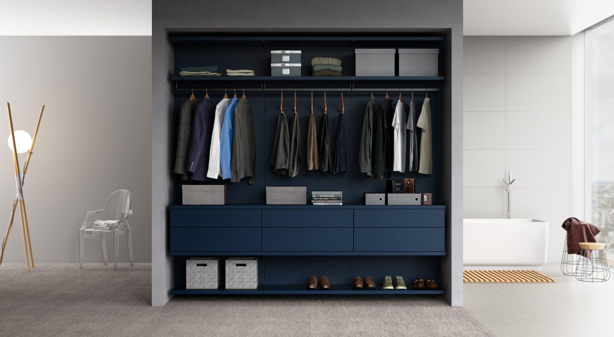 Closet in navy matte finish design with custom drawers made by California Closets