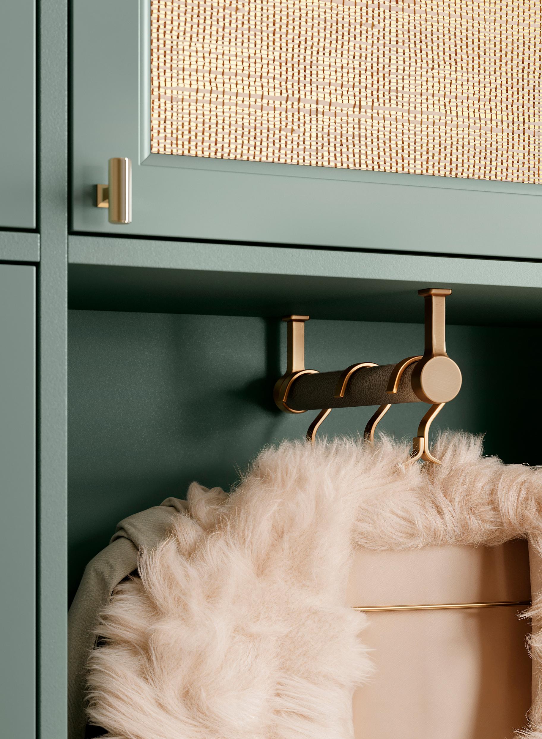 Closet details view of valet rod in Desert Agave green finish from California Closets