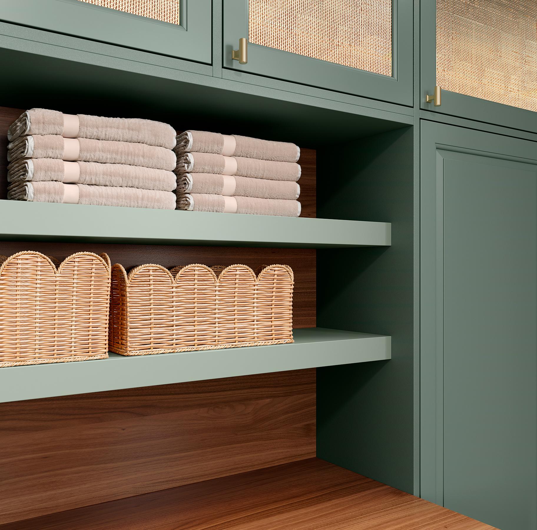 Open shelving in laundry room for linens storage from California Closets