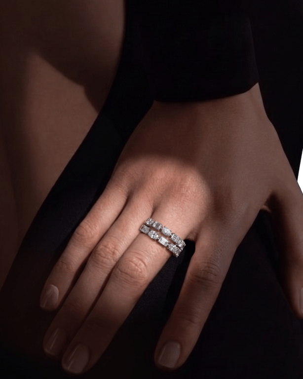 A double band set with emerald-cut and round diamonds, worn