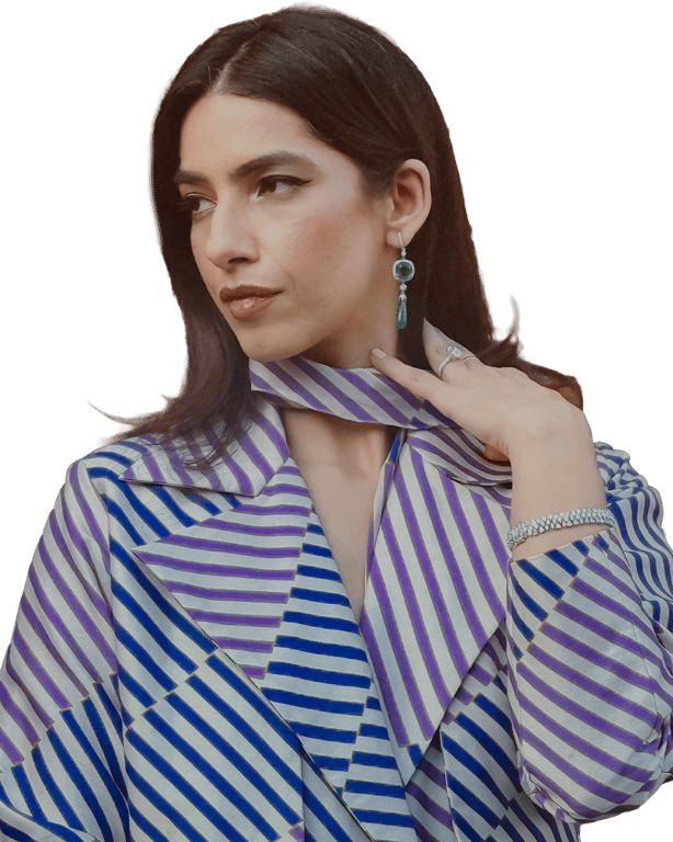 Carbon gemstone drop earrings and diamond bracelet worn with a striped coat