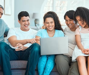 shot of a beautiful family using a laptop while bo 2023 11 27 04 53 04 utc min