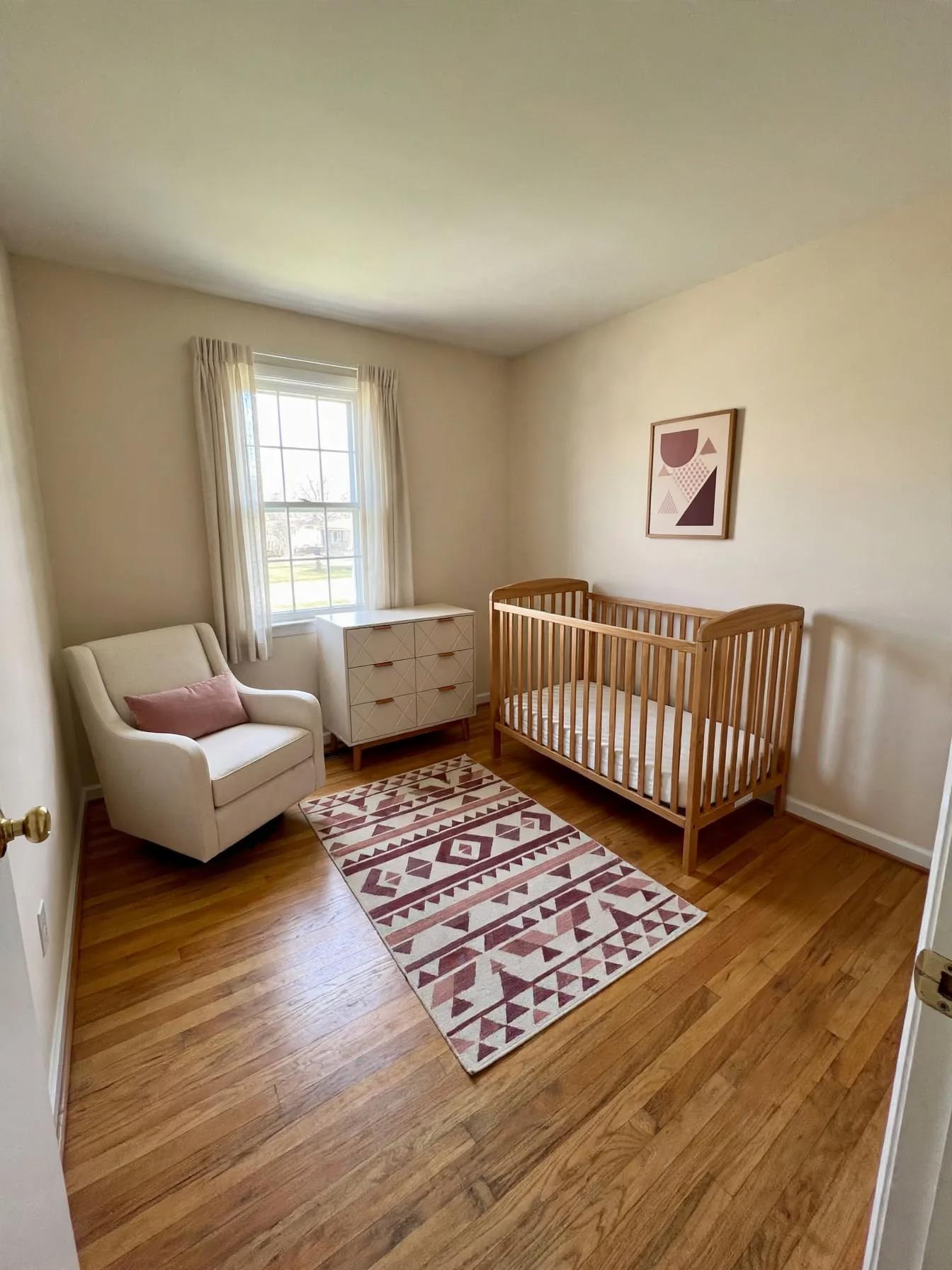 Contemporary nursery after AI virtual staging by Renovaitor: Single window and oak crib define a soft contemporary nursery