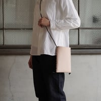 lille og stor / lomme (S) / black × natural