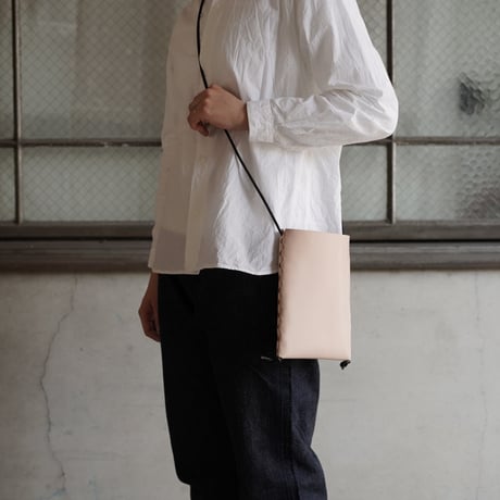 lille og stor / lomme (S) / black × natural