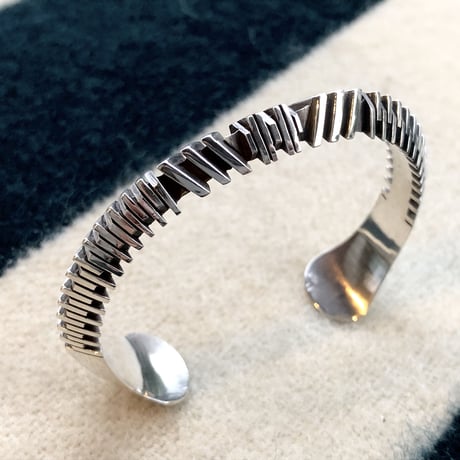 "Isaiah Ortiz" (sun felipe)” hand cut triangle bangle