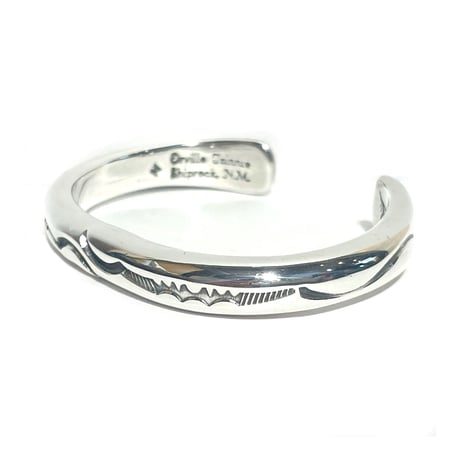 indian jewelry "Orville Tsinnie (navajo)” stamped round bangle