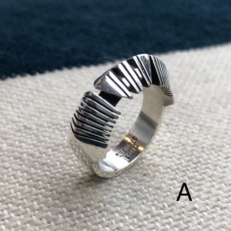 "Isaiah Ortiz" (sun felipe)” hand cut triangle ring