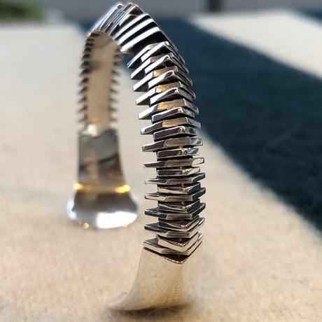 "Isaiah Ortiz" (sun felipe)” hand cut triangle bangle