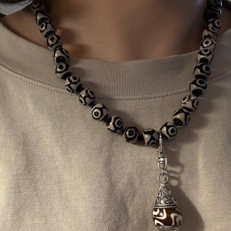 Black eye necklace