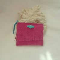 Pink leather mini pouch.