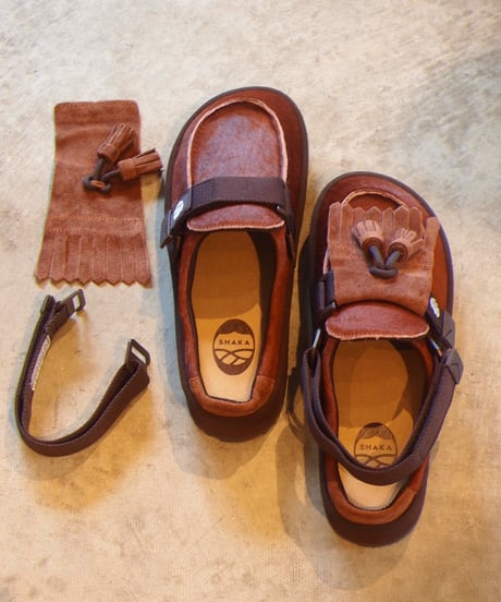 "SHAKA"MOC MULE TASSEL COWHAIR