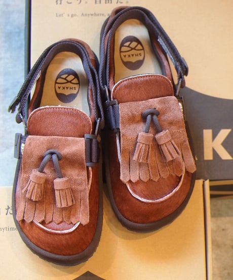 "SHAKA"MOC MULE TASSEL COWHAIR