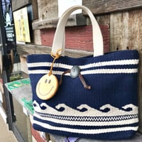 Smile wood charm付き Wave tote bag