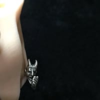 耳元で囁く悪魔と天使のピアス | progressive art jewelry