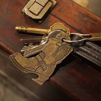 "There is a snake in my boot" Brass Opener Keyring