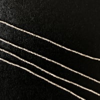 カレンシルバー／ビーズ・キューブカット1.1mm　1連（約70cm）