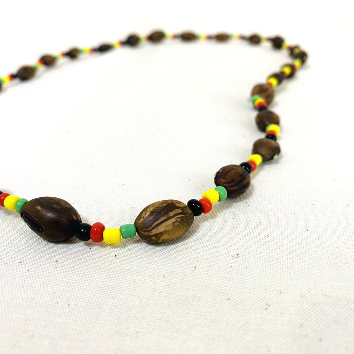 ⚪︎JA直輸入 necklace natural black×rasta | レゲエとジャマ