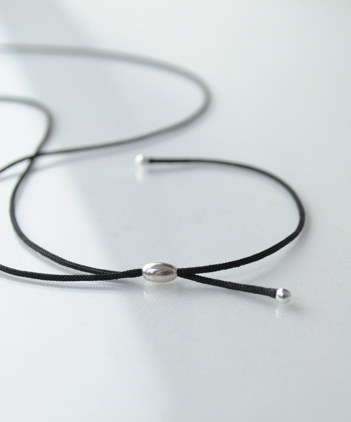 anq.】シルバー925 ハートモティーフ シルクコード ロングペンダント