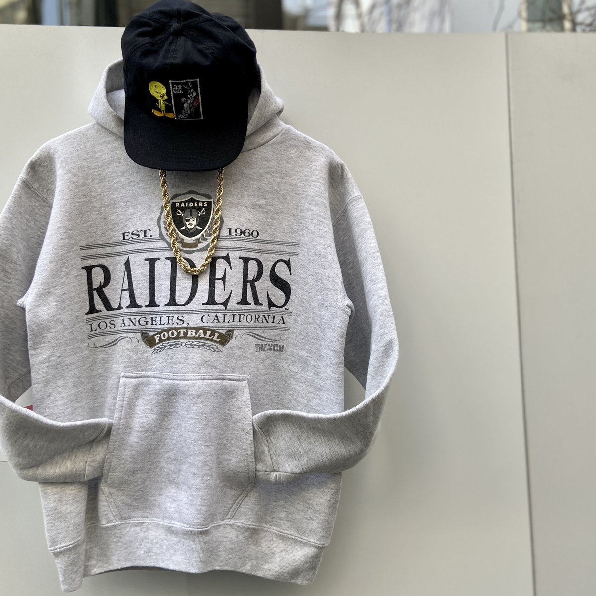 NFL RAIDERS/ロサンゼルスレイダース フードスウェット 90年代 Made In USA(USED)