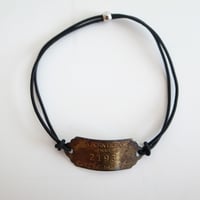 BRASS TAG HAIR GOM BRACE