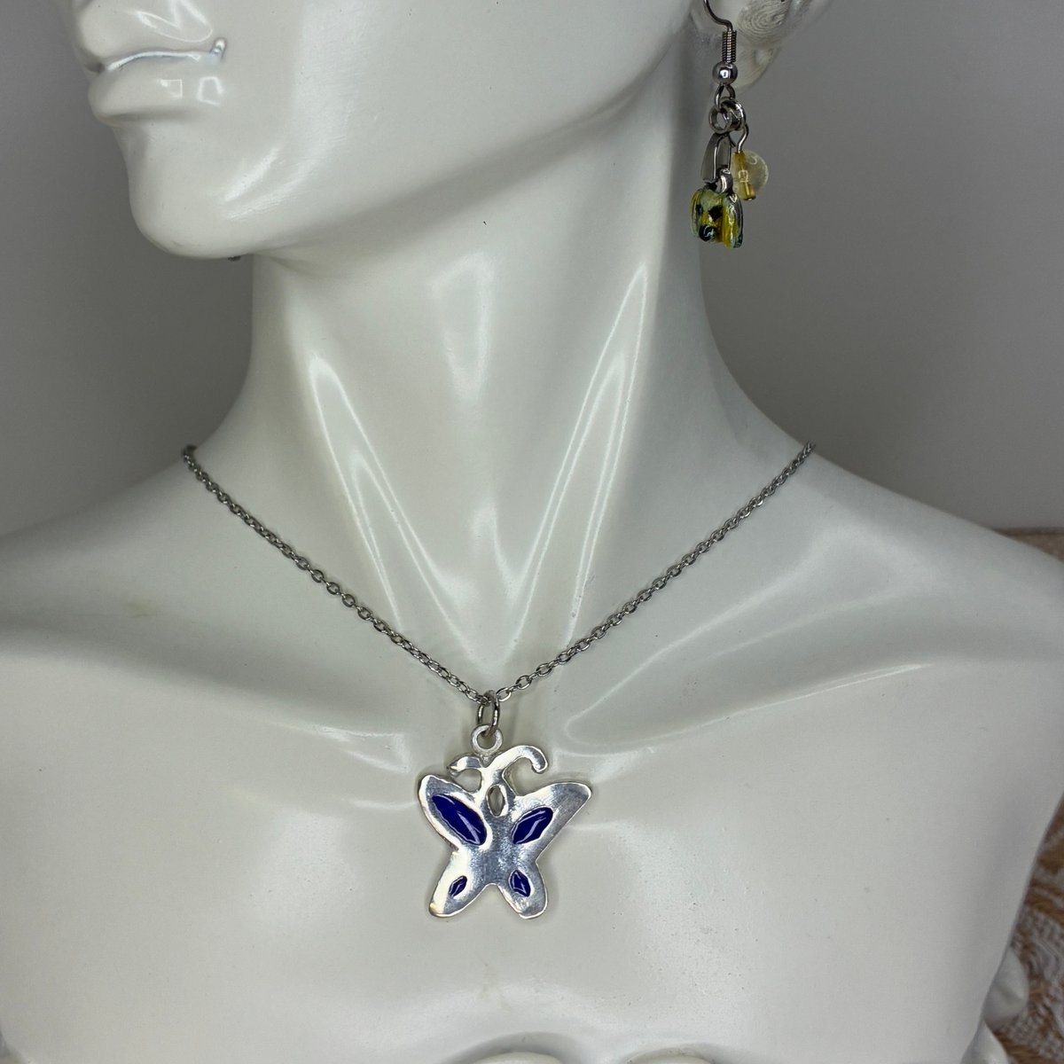 透胎七宝の蝶ネックレス｜ブルー × シルバー｜変化と成長のお守り | WAKACO