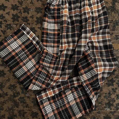 Black, orange, ＆ white checked flannel pajama pants.
