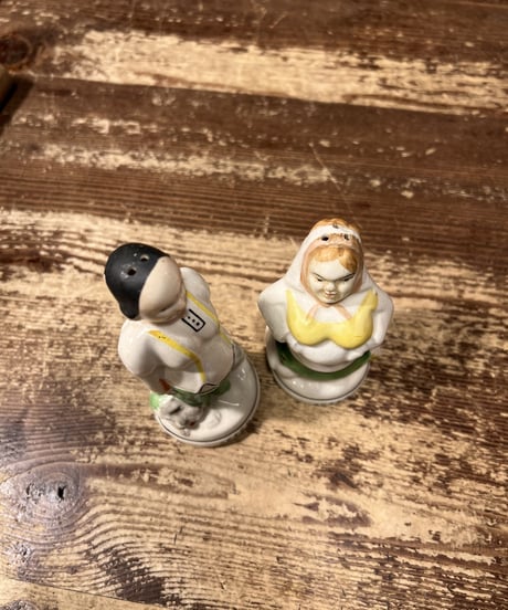 Pottery couple-shaped salt and pepper shaker.