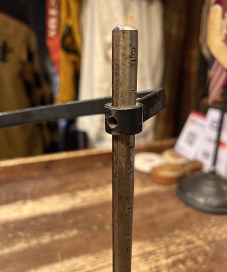 Antique metal skirt gauge.