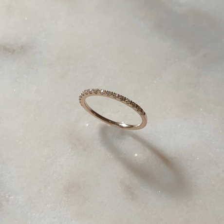Tiny diamond half eternity ring