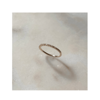Tiny diamond half eternity ring