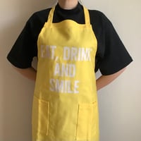 WPY3   DAY USE W POCKET  APRON   “EAT DRINK  AND SMILE“” YELLOW COLOR