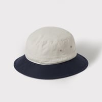 PHIGVEL‐MAKERS Co.  CHINO CLOTH BUCKET HAT (Ecru×G.Navy)
