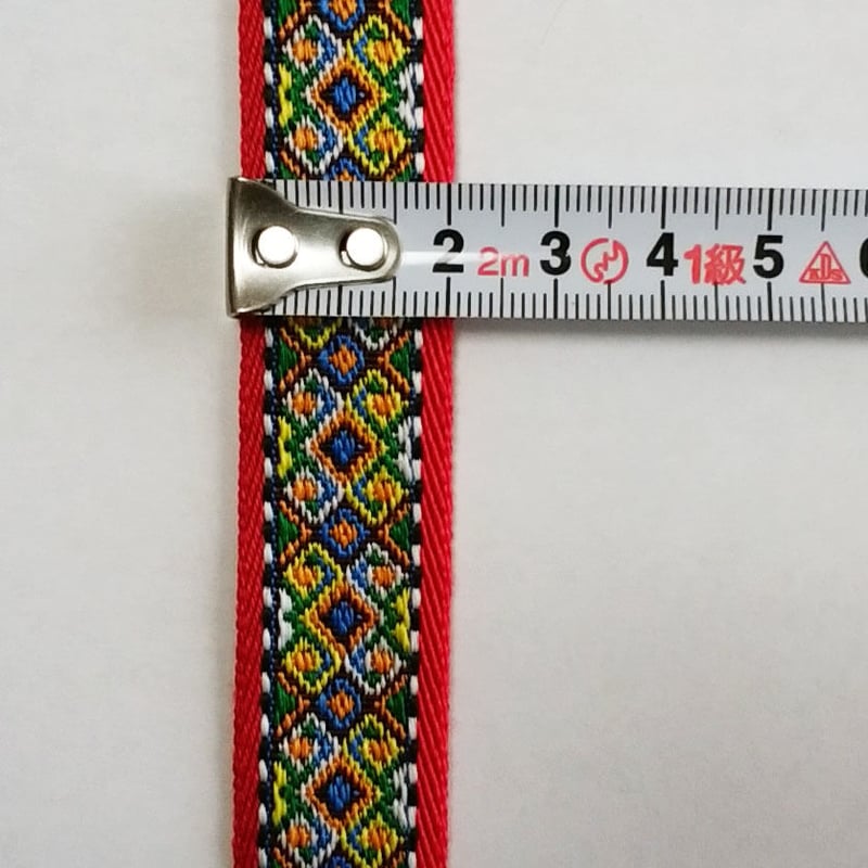 20mmチロリアンテープ「赤系ダイヤ柄」（10cm単位） | 中国