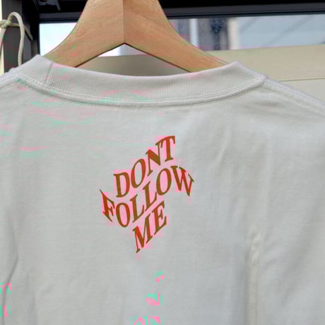 Somewhat beige-ish white, like the hot summer clouds tee