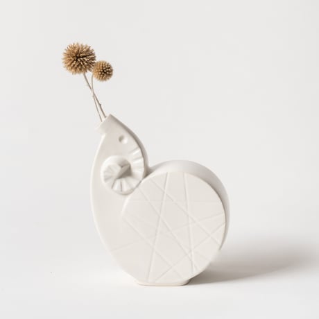 curled sheep vase