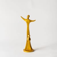 open-arms statue